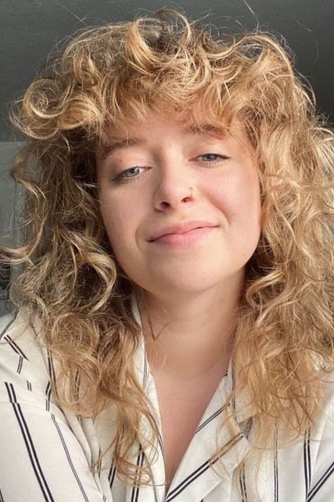 Blonde Curly Bangs Hairstyle