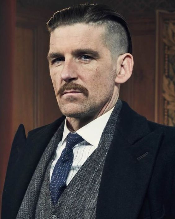 Slicked-Back Peaky Blinders Style with Tapered Sides